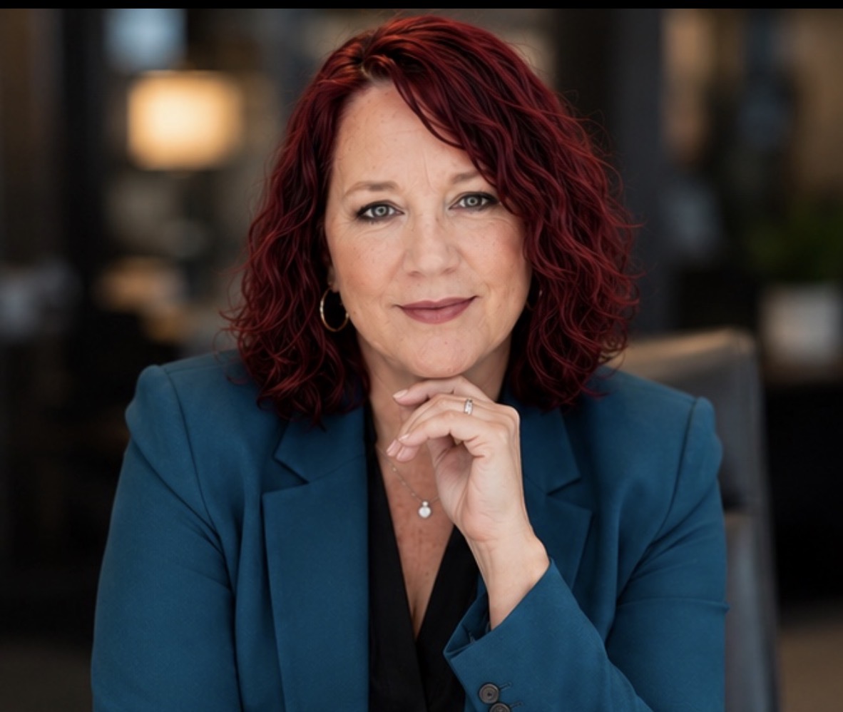 Mariquita Joy The Ladybug in a teal blazer — keynote speaker portrait